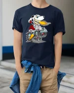 Funny Dog Driving Monster Truck T Shirt Fire Breathing Cartoon - model wearing navy tee with hands in pockets