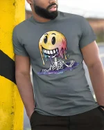 Melting Smile Skeleton Graphic T Shirt Funny Creepy Cute Vibe - model wearing grey tee, leaning on column