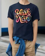 Yeah Nah Funny Aussie Slang Retro Vibes Graphic T Shirt - model wearing navy tee with hands in pockets