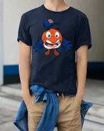 Funny Orange Mascot Baseball Cartoon Graphic T Shirt - model wearing navy tee with hands in pockets