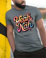 Yeah Nah Funny Aussie Slang Retro Vibes Graphic T Shirt - model wearing grey tee, leaning on column