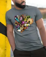 Colorful Art Supplies Creative Doodle Graphic T Shirt - model wearing grey tee, leaning on column