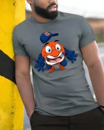 Funny Orange Mascot Baseball Cartoon Graphic T Shirt - model wearing grey tee, leaning on column