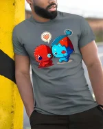 Adorable Monster Love Pair Cartoon Style Graphic T Shirt Tee - model wearing grey tee, leaning on column