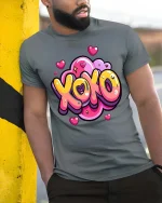 XOXO Love Heart Cute Cartoon Valentines Graphic T-Shirt - model wearing grey tee, leaning on column