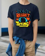 Dont Regret Just Try Bold Motivational Quote Graphic Tshirt - model wearing navy tee with hands in pockets