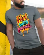 Flirt With Purpose Bold Colorful Drip Typography Tshirt - model wearing grey tee, leaning on column