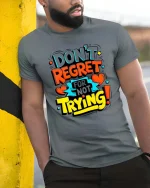 Dont Regret Just Try Bold Motivational Quote Graphic Tshirt - model wearing grey tee, leaning on column