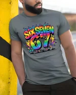 Six Seven 67 Rainbow Cartoon Number Fun Graphic Tshirt - model wearing grey tee, leaning on column