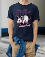 Dreams Drift Away Mouse Graphic T-Shirt Cute Surreal Tee - model wearing navy tee with hands in pockets