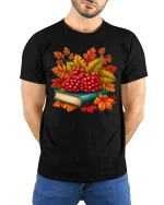 Autumn Berries Book Stack Graphic T-Shirt Cozy Fall Tee - model wearing black tee with hands behind back