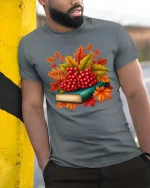 Autumn Berries Book Stack Graphic T-Shirt Cozy Fall Tee - model wearing grey tee, leaning on column