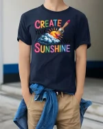 Create Your Own Sunshine Graphic T-Shirt Positive Art Tee - model wearing navy tee with hands in pockets