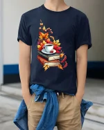 Cozy Autumn Coffee Books Graphic T-Shirt Fall Reading Tee - model wearing navy tee with hands in pockets