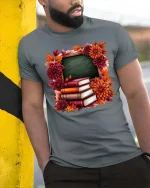 Autumn Teacher Books Chalkboard Graphic T-Shirt Fall School Tee - model wearing grey tee, leaning on column