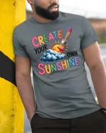 Create Your Own Sunshine Graphic T-Shirt Positive Art Tee - model wearing grey tee, leaning on column