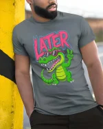 Later Gator Funny Alligator Cool Graphic T Shirt Style - model wearing grey tee, leaning on column