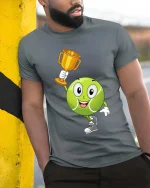 Tennis Champion Cute Ball Winner Graphic T Shirt Style - model wearing grey tee, leaning on column