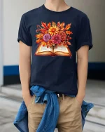 Autumn Book Floral Graphic T Shirt Cozy Fall Reader Tee - model wearing navy tee with hands in pockets