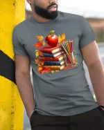 Autumn Books Apple Teacher Classroom Art Style tshirt - model wearing grey tee, leaning on column
